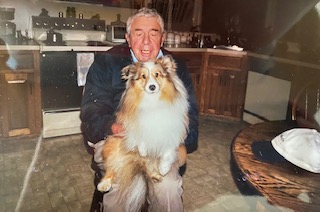 Dad Smiling with Nicky on his lap